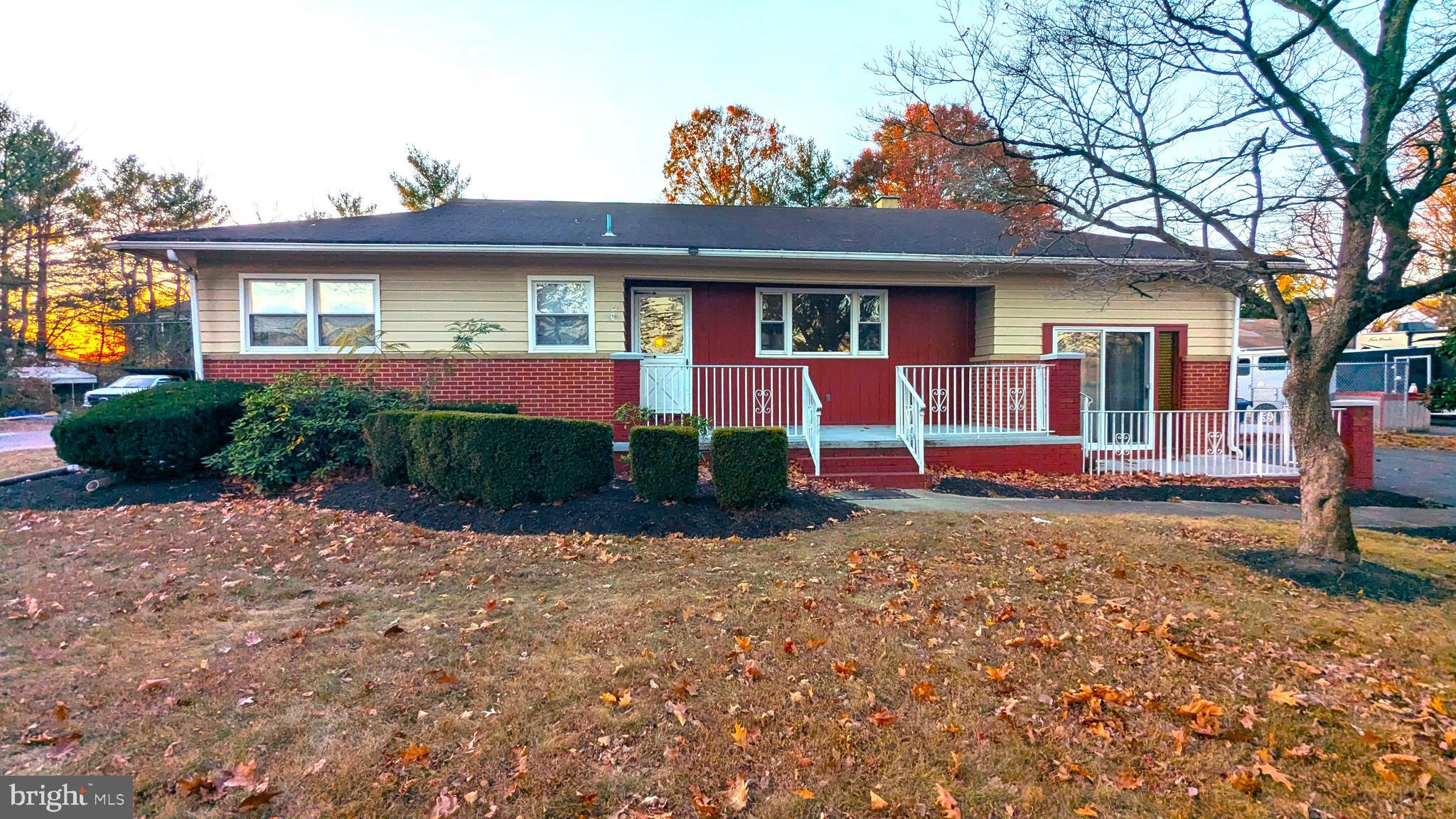 4032 Quakerbridge Road Lawrenceville, NJ 08648 - Photo 1 of 18 a front view of a house with garden
