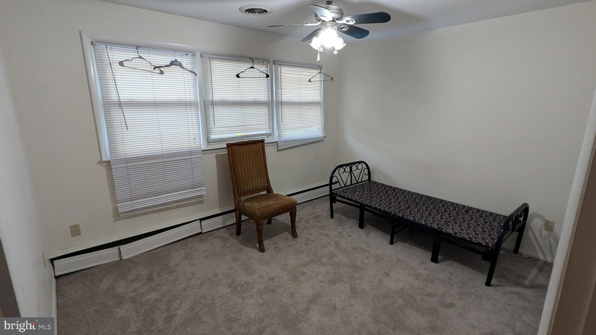 4032 Quakerbridge Road Lawrenceville, NJ 08648 - Photo 11 of 18 a living room with furniture and a window