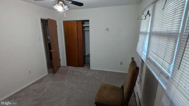 a view of room with window and hallway