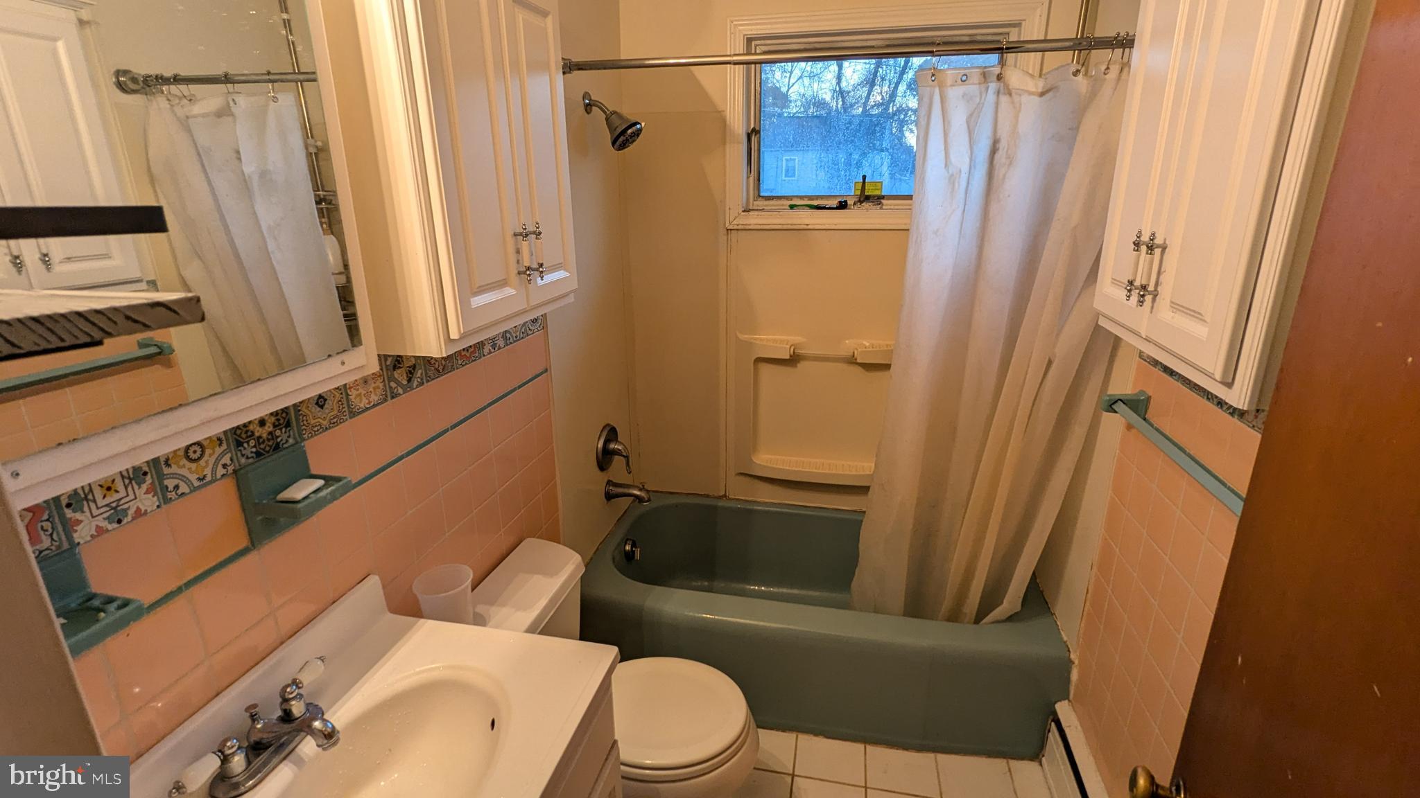 4032 Quakerbridge Road Lawrenceville, NJ 08648 - Photo 10 of 18 a white toilet sitting next to a bathroom sink