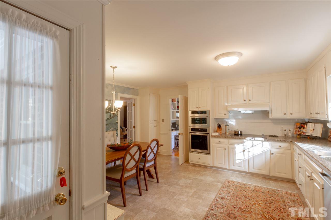 3113 Cartwright Drive Raleigh, NC 27612 - Photo 13 of 25 a view of a kitchen with table and chairs