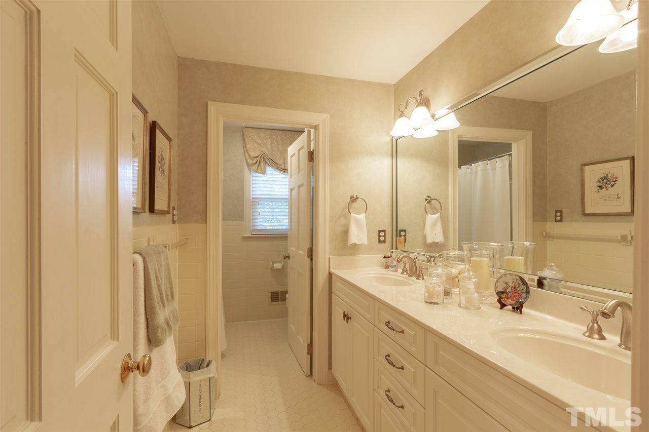 3113 Cartwright Drive Raleigh, NC 27612 - Photo 17 of 25 a bathroom with a double vanity sink mirror and double