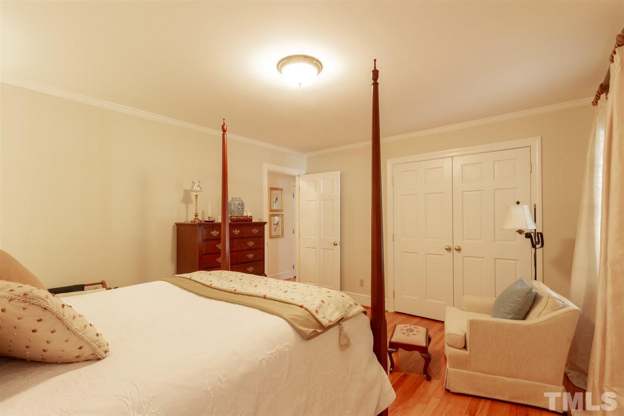 3113 Cartwright Drive Raleigh, NC 27612 - Photo 22 of 25 a bedroom with a bed and furniture