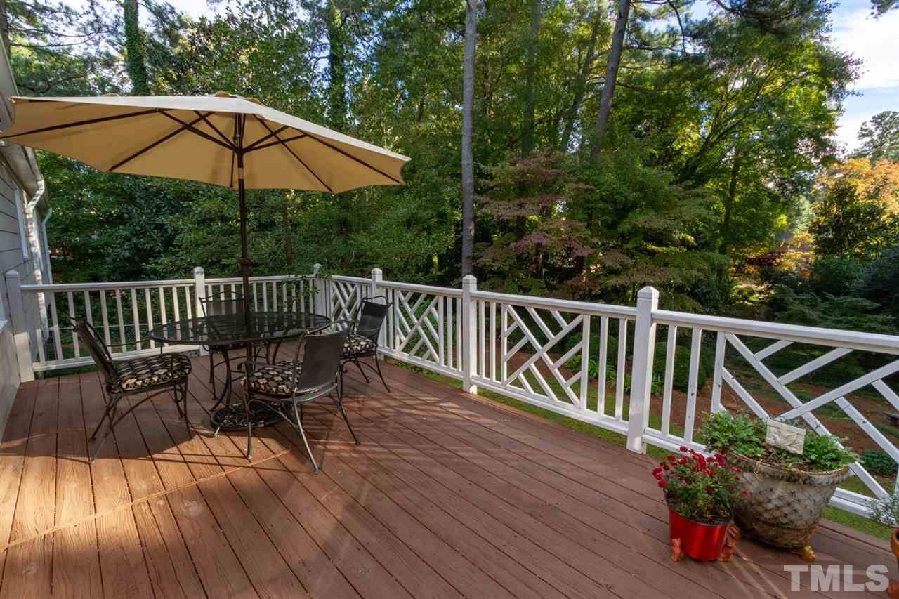 3113 Cartwright Drive Raleigh, NC 27612 - Photo 23 of 25 a view of balcony with outdoor seating and wooden floor