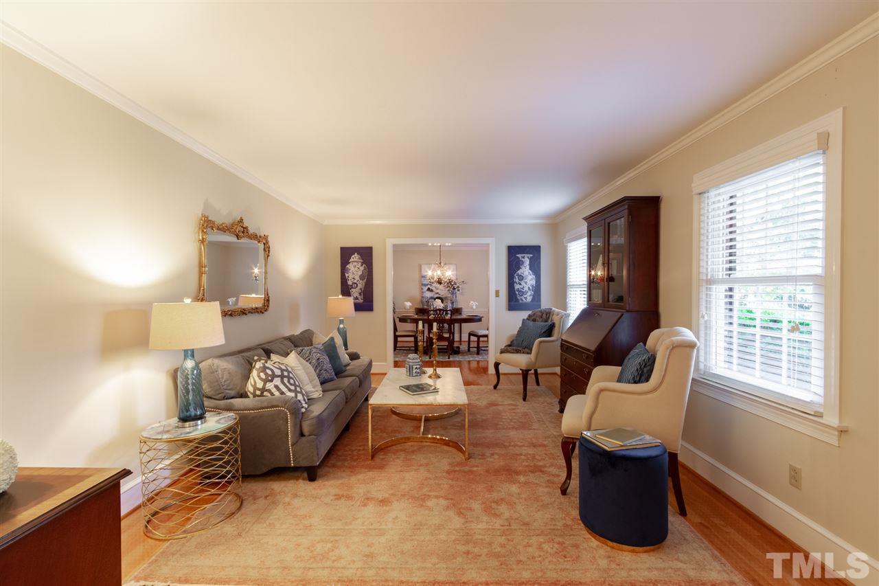 3113 Cartwright Drive Raleigh, NC 27612 - Photo 5 of 25 a living room with furniture and a window
