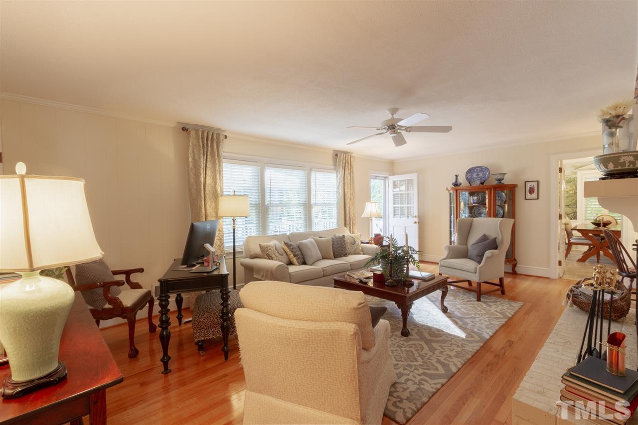 3113 Cartwright Drive Raleigh, NC 27612 - Photo 10 of 25 a living room with furniture and wooden floor