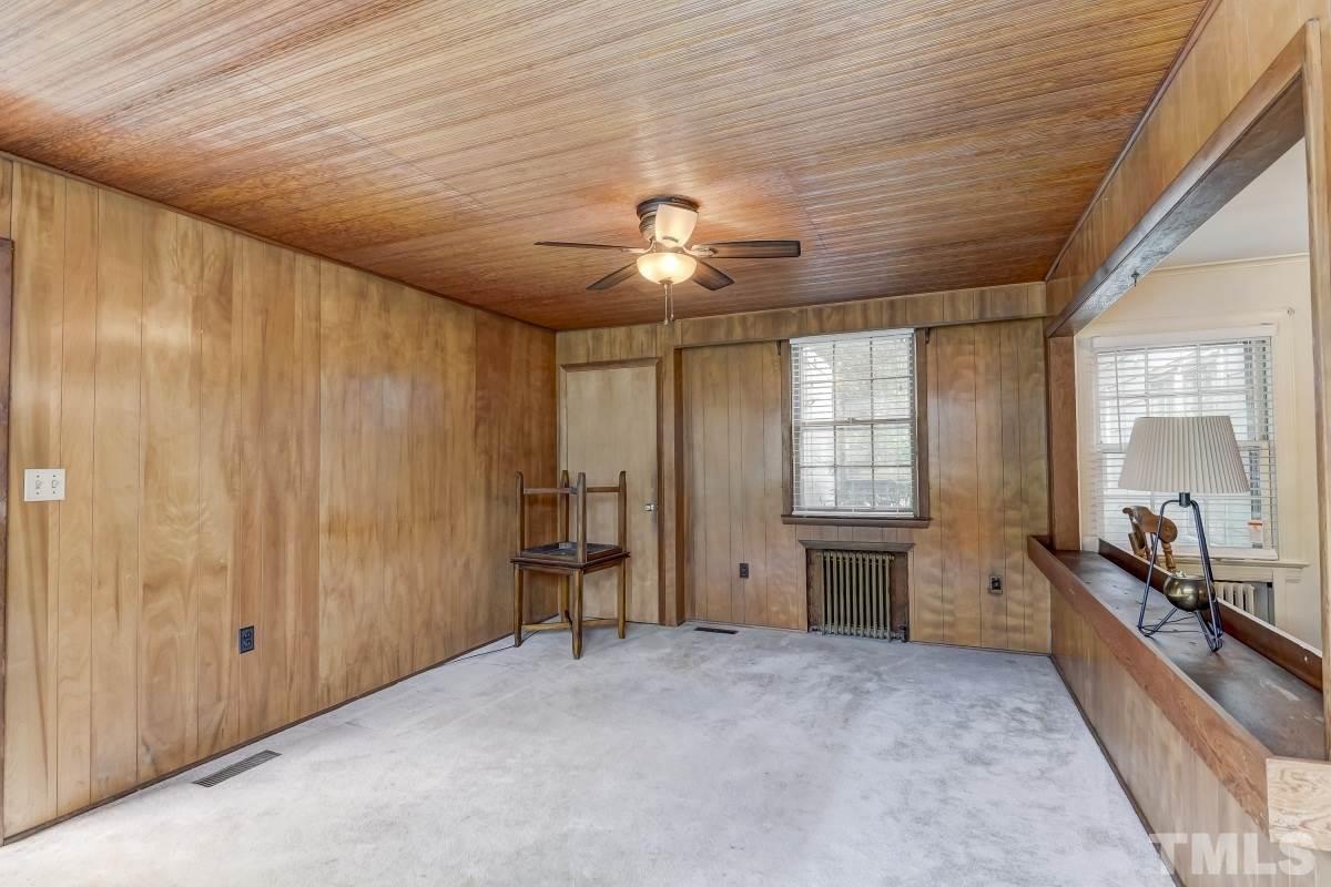405 East Franklin Street Raleigh, NC 27604 - Photo 3 of 17 a large room with chandelier fan and windows