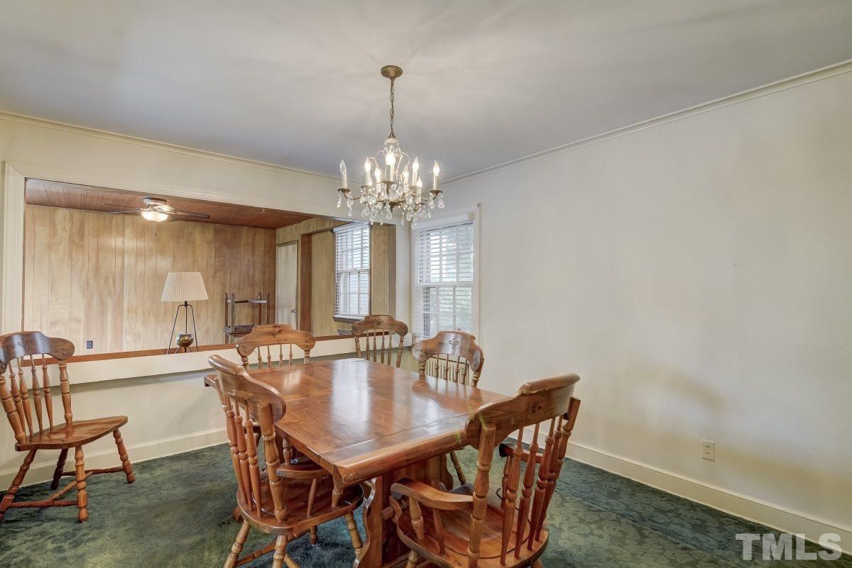 405 East Franklin Street Raleigh, NC 27604 - Photo 5 of 17 a view of a dining room with furniture and chandelier