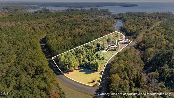 an aerial view of a house with a lake view