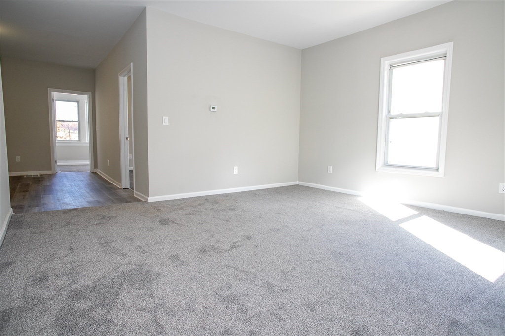 57-59 Cottage Street Athol, MA 01331 - Photo 12 of 42 an empty room with windows and closet