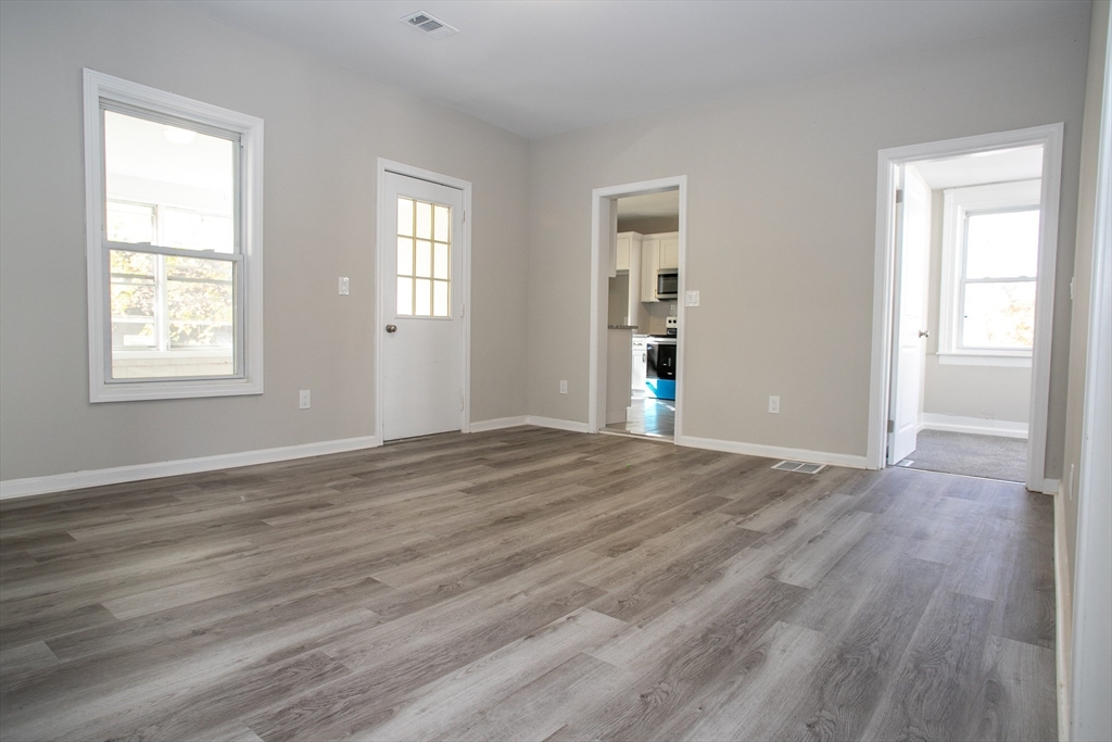 57-59 Cottage Street Athol, MA 01331 - Photo 15 of 42 a view of an empty room with wooden floor and a window