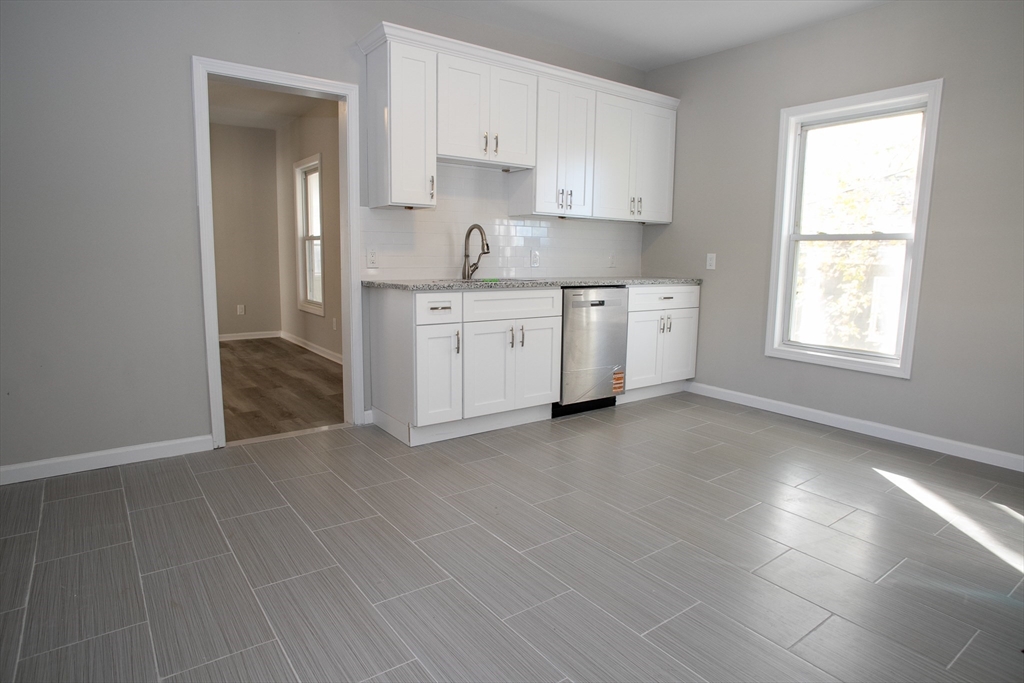 57-59 Cottage Street Athol, MA 01331 - Photo 16 of 42 a view of kitchen with granite countertop cabinets and window