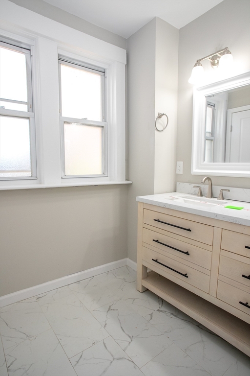 57-59 Cottage Street Athol, MA 01331 - Photo 20 of 42 a bathroom with a sink and a mirror