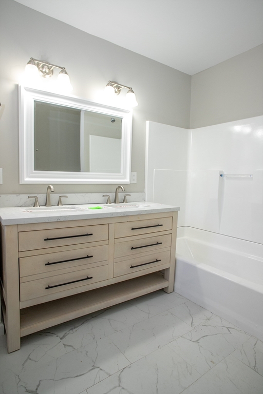 57-59 Cottage Street Athol, MA 01331 - Photo 21 of 42 a bathroom with a double vanity sink mirror and bathtub