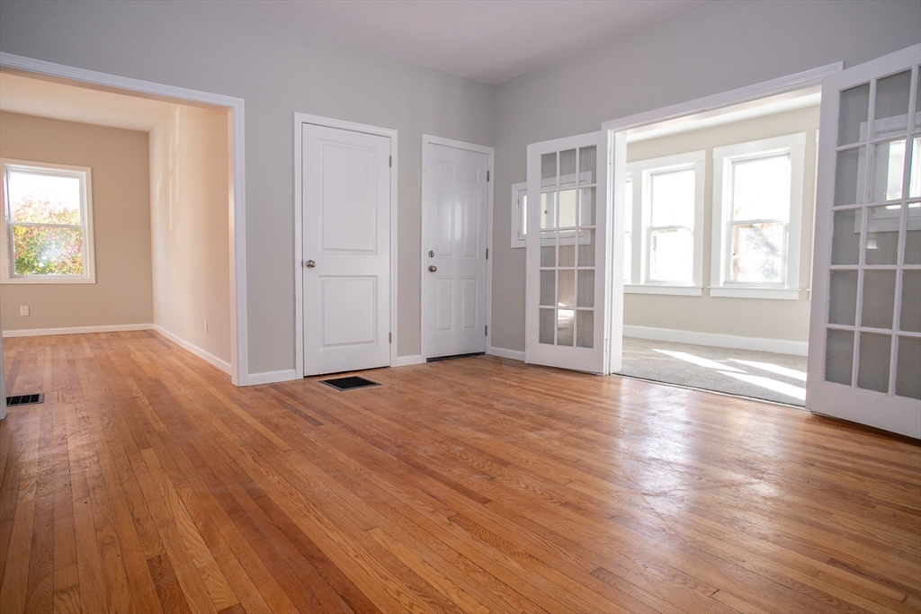 57-59 Cottage Street Athol, MA 01331 - Photo 30 of 42 an empty room with wooden floor and windows