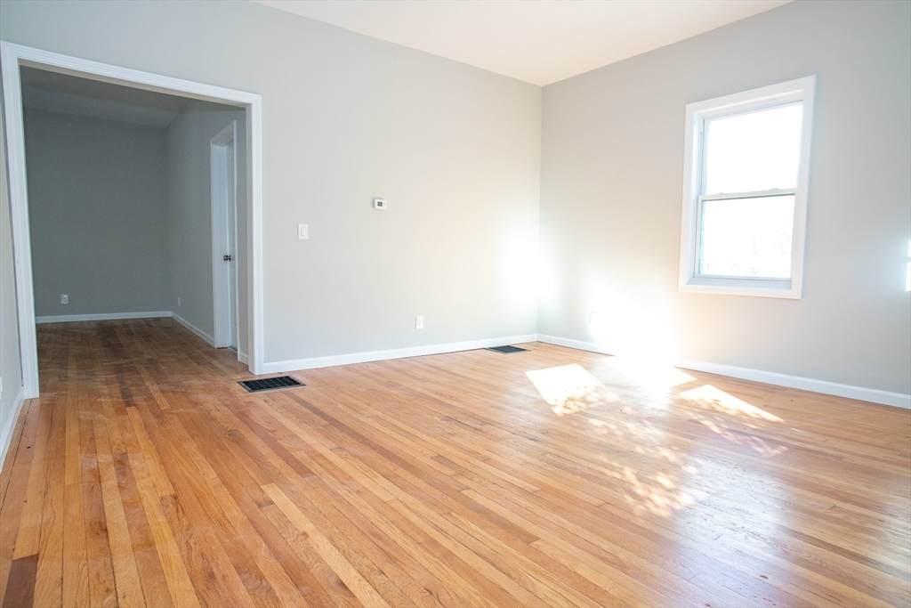 57-59 Cottage Street Athol, MA 01331 - Photo 32 of 42 an empty room with wooden floor and windows