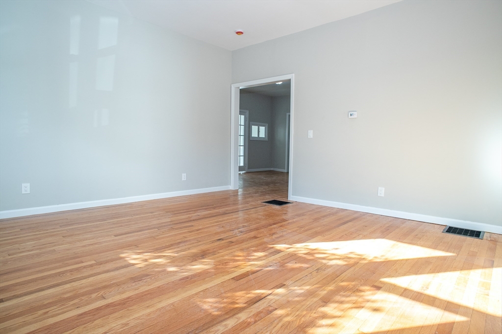 57-59 Cottage Street Athol, MA 01331 - Photo 33 of 42 a view of an empty room with wooden floor