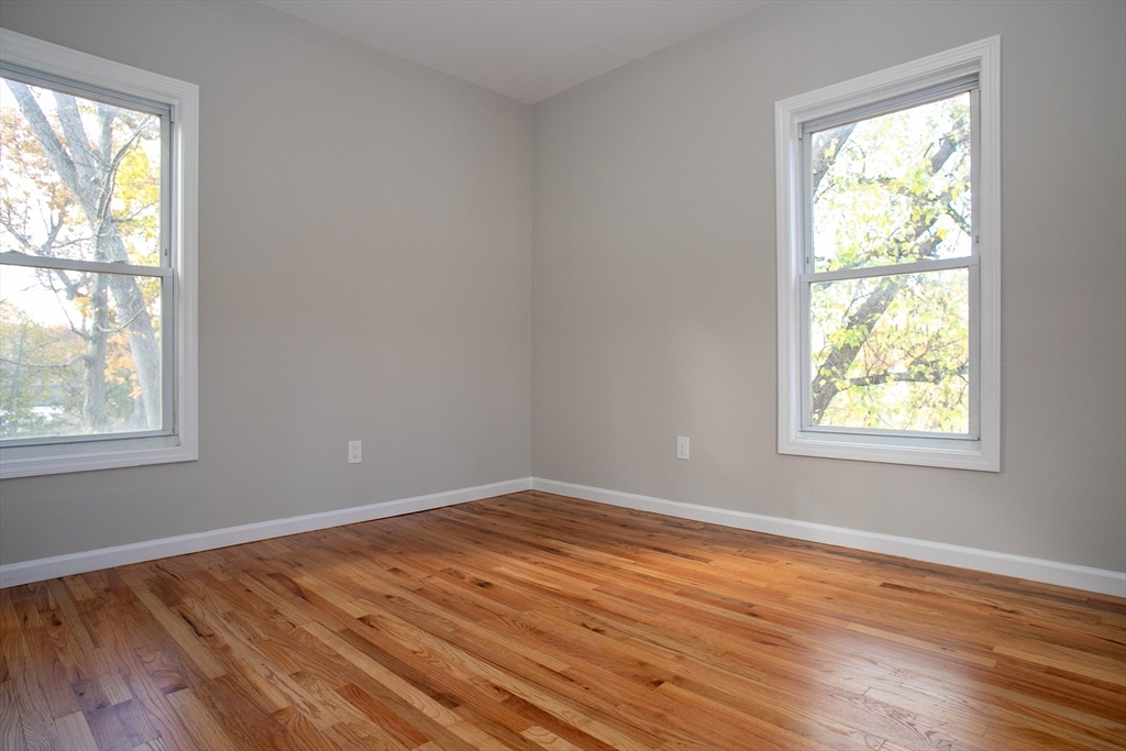 57-59 Cottage Street Athol, MA 01331 - Photo 35 of 42 an empty room with wooden floor and windows