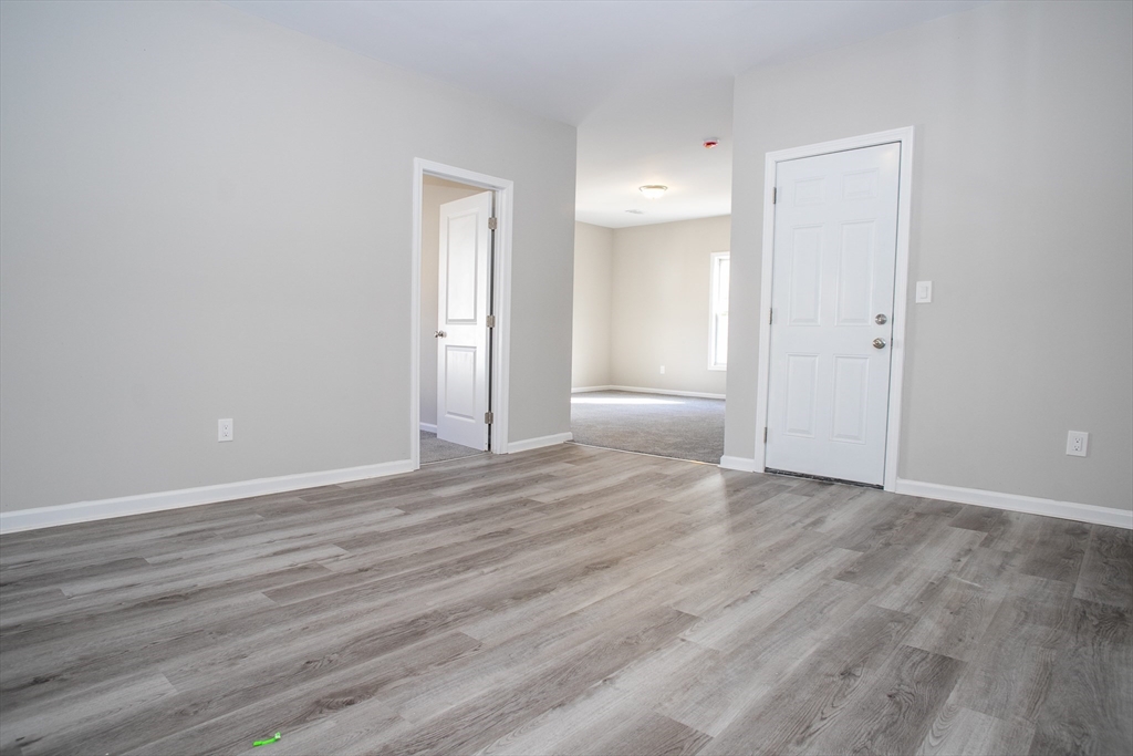57-59 Cottage Street Athol, MA 01331 - Photo 10 of 42 a view of an empty room and wooden floor