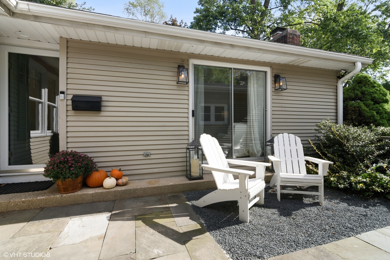 1133 Willow Road Winnetka, IL 60093 - Photo 2 of 26 a view of a chair and fire pit in the backyard