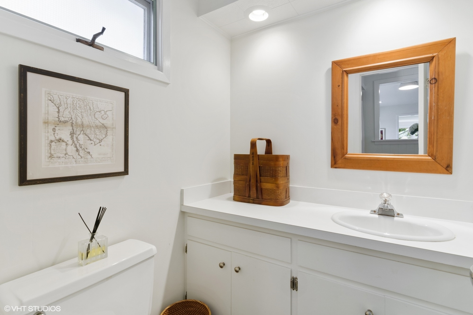 1133 Willow Road Winnetka, IL 60093 - Photo 14 of 26 a bathroom with a toilet sink and mirror