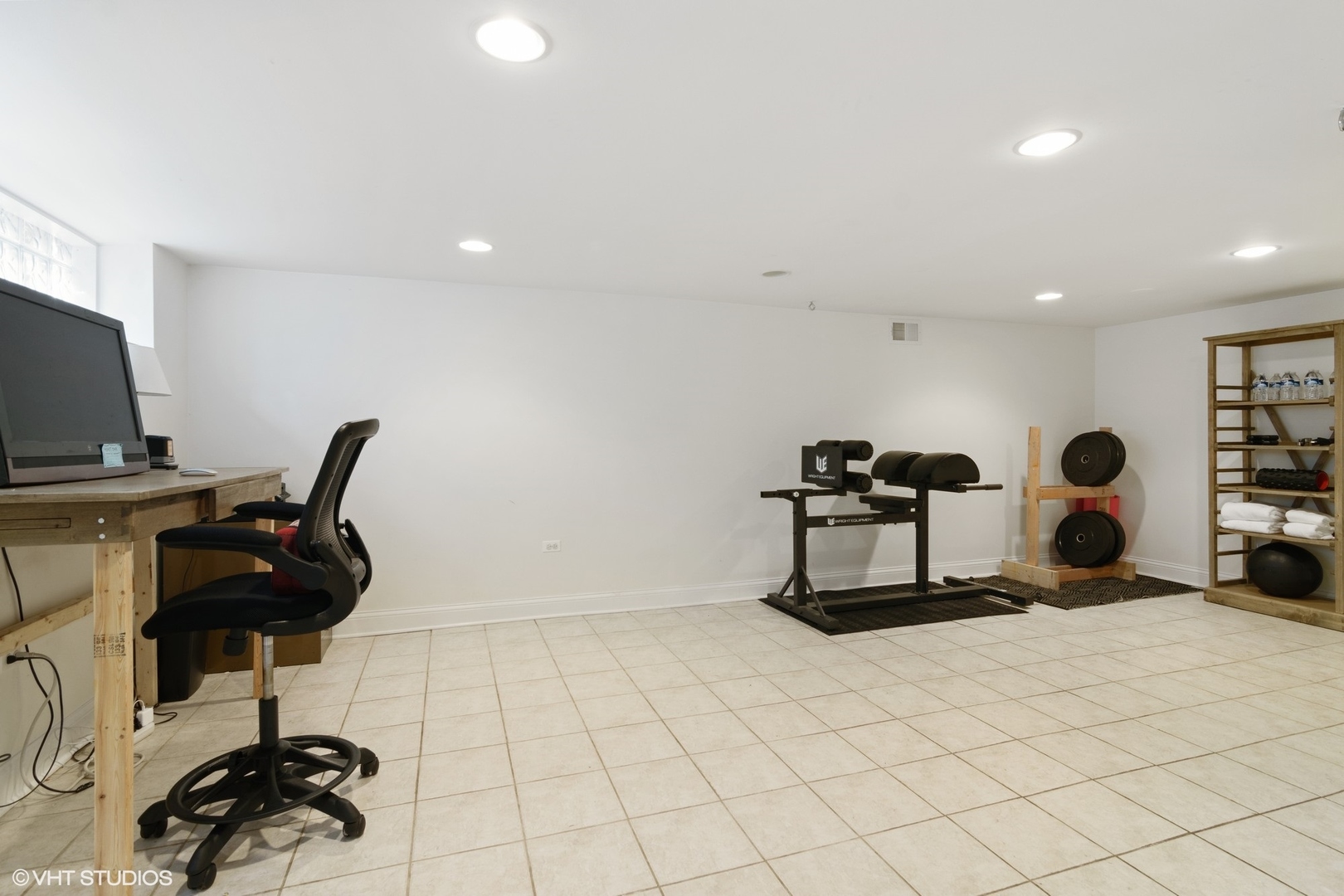 1133 Willow Road Winnetka, IL 60093 - Photo 20 of 26 a room with gym equipment and a view of living room