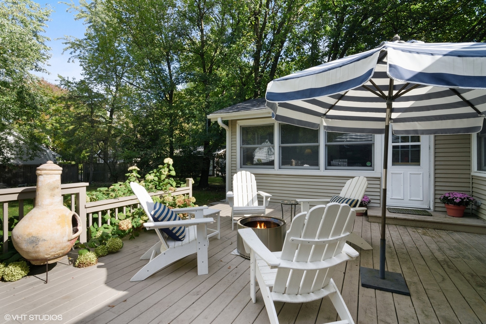 1133 Willow Road Winnetka, IL 60093 - Photo 21 of 26 a view of a patio with table and chairs and wooden floor