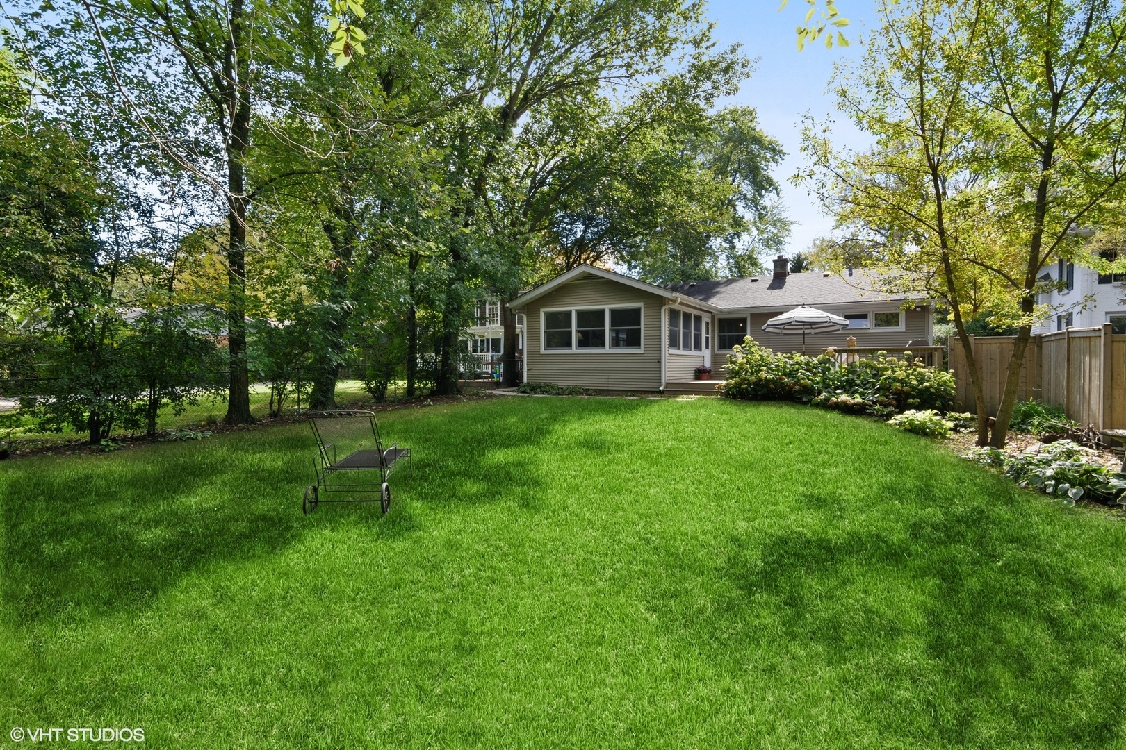 1133 Willow Road Winnetka, IL 60093 - Photo 23 of 26 a view of a house with a yard and tree s