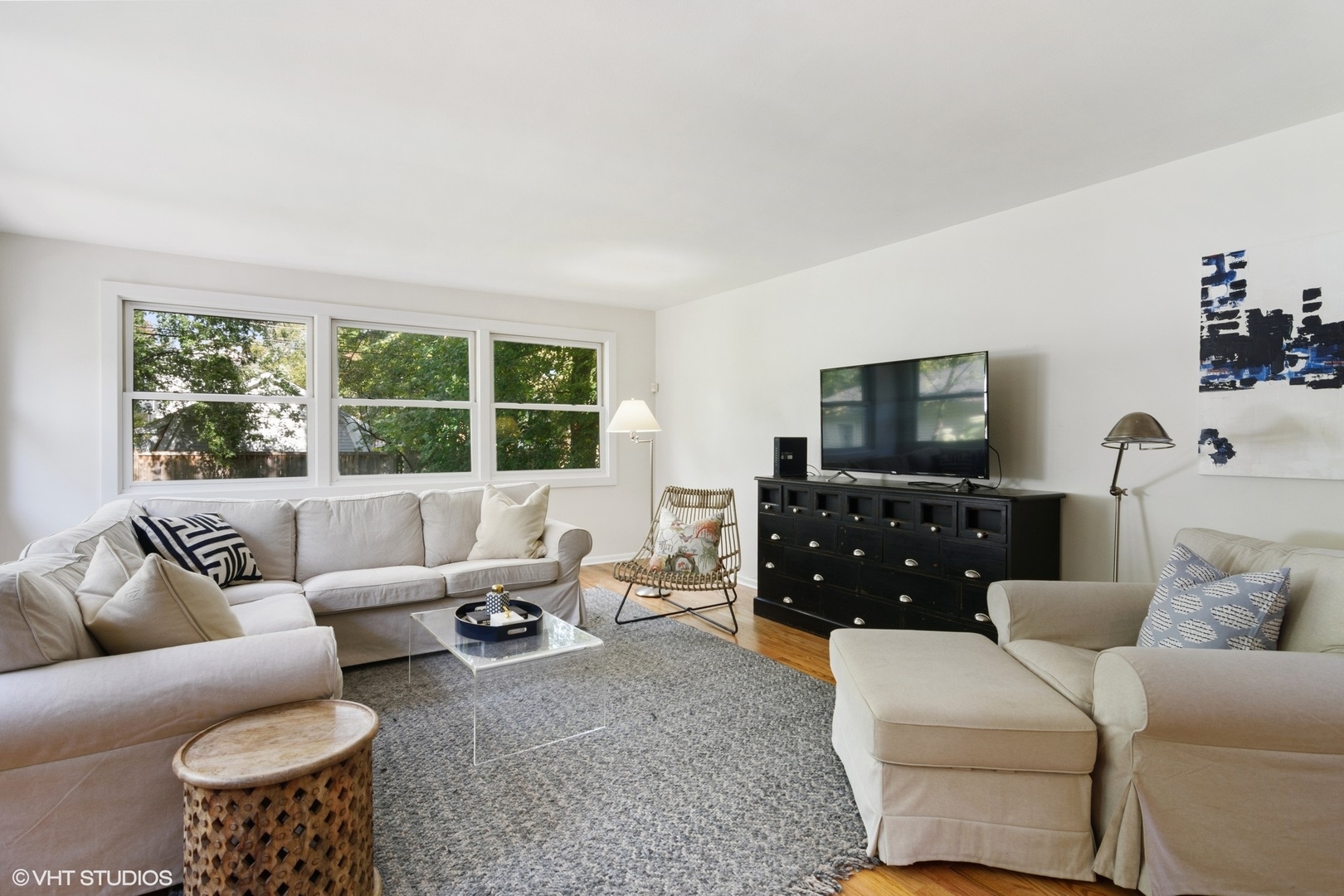 1133 Willow Road Winnetka, IL 60093 - Photo 5 of 26 a living room with furniture and a flat screen tv