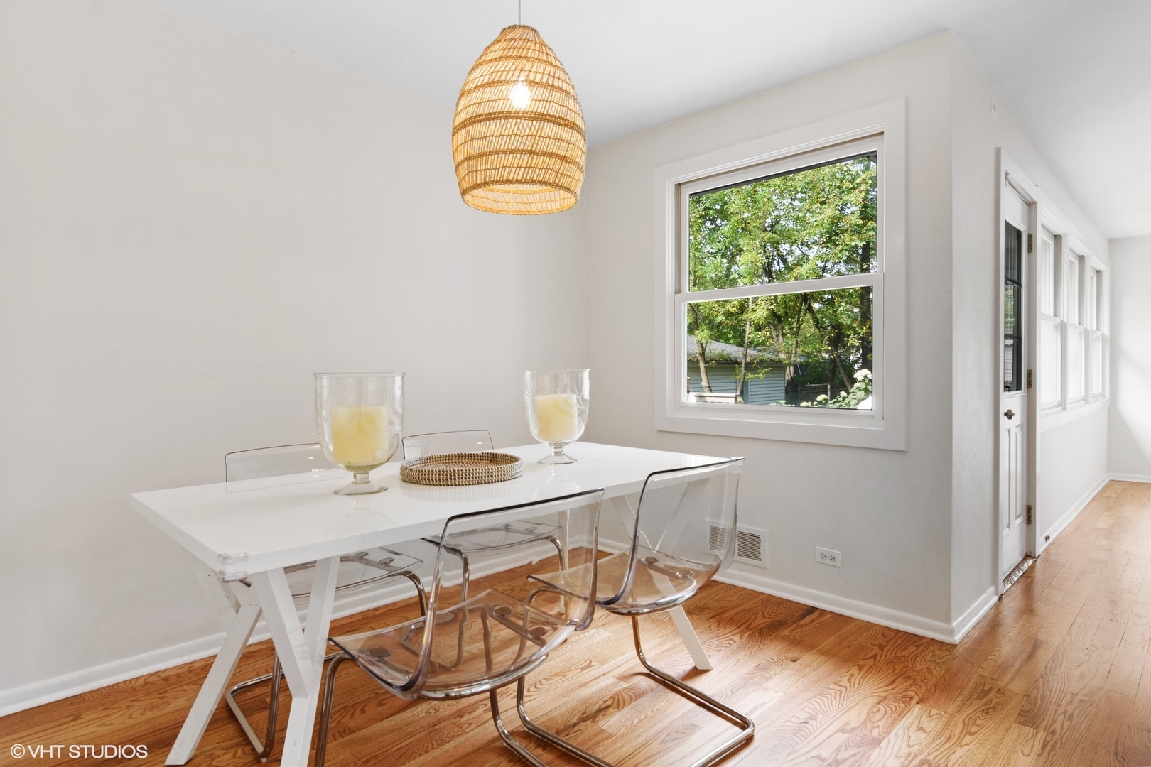 1133 Willow Road Winnetka, IL 60093 - Photo 8 of 26 a view of a dining room with a table and chairs
