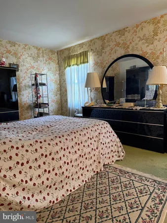 a bedroom with a bed and a fireplace