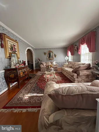 a living room with furniture window and a fireplace