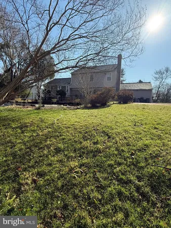 a view of a backyard of the house