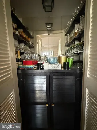 a kitchen with a refrigerator and window
