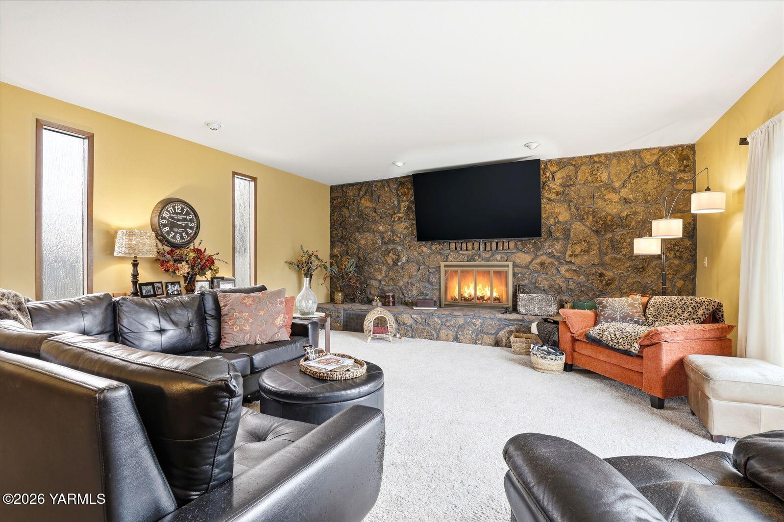 212 South 46th Avenue Yakima, WA 98908 - Photo 12 of 31 a living room with furniture and a flat screen tv