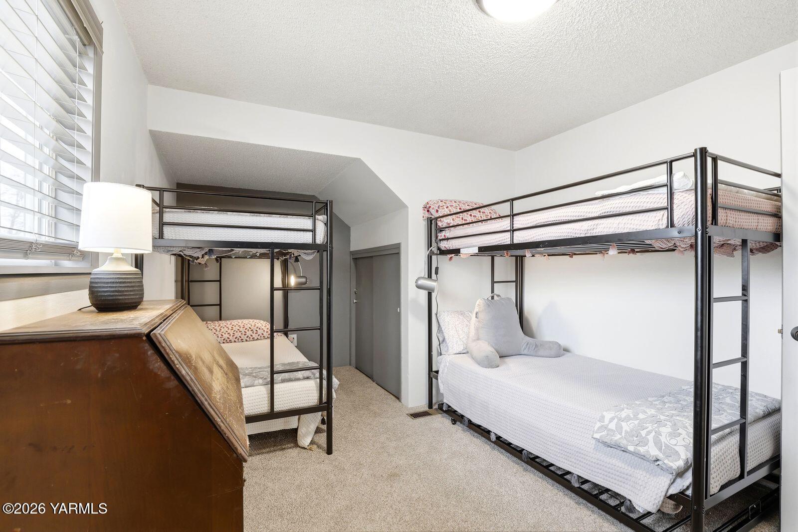 212 South 46th Avenue Yakima, WA 98908 - Photo 19 of 31 a bedroom with a bed and a window