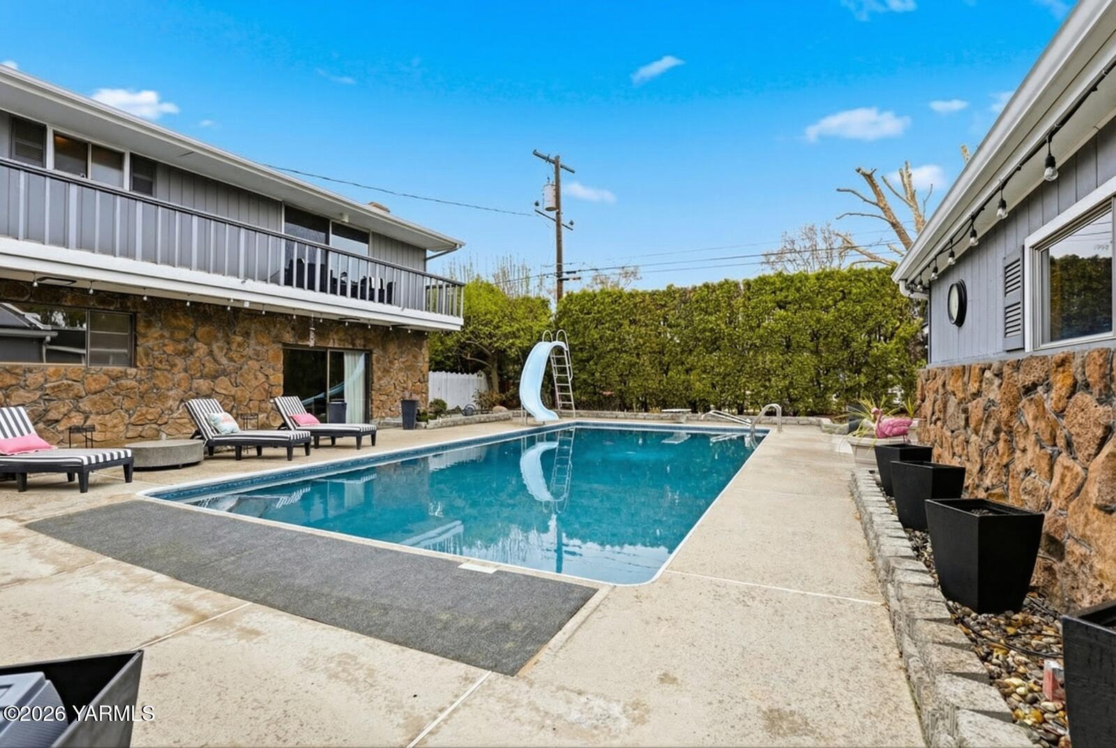 212 South 46th Avenue Yakima, WA 98908 - Photo 29 of 31 a front view of a house with swimming pool
