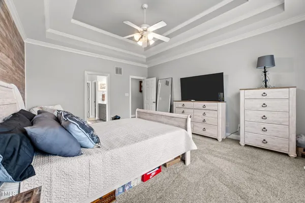 a bedroom with bed and window