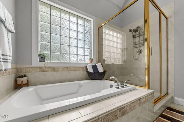 a view of a livingroom with furniture and a flat screen tv