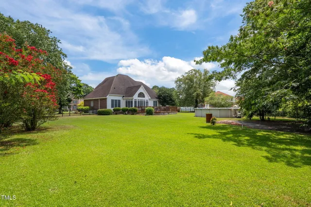 a roof deck with a table and a chair