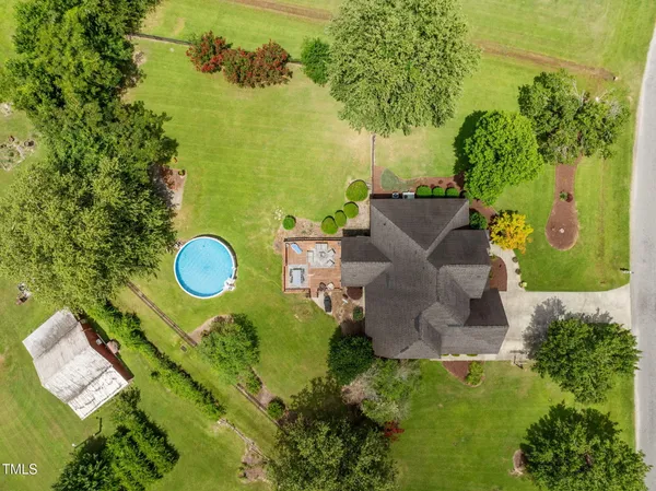 a aerial view of a house with a yard