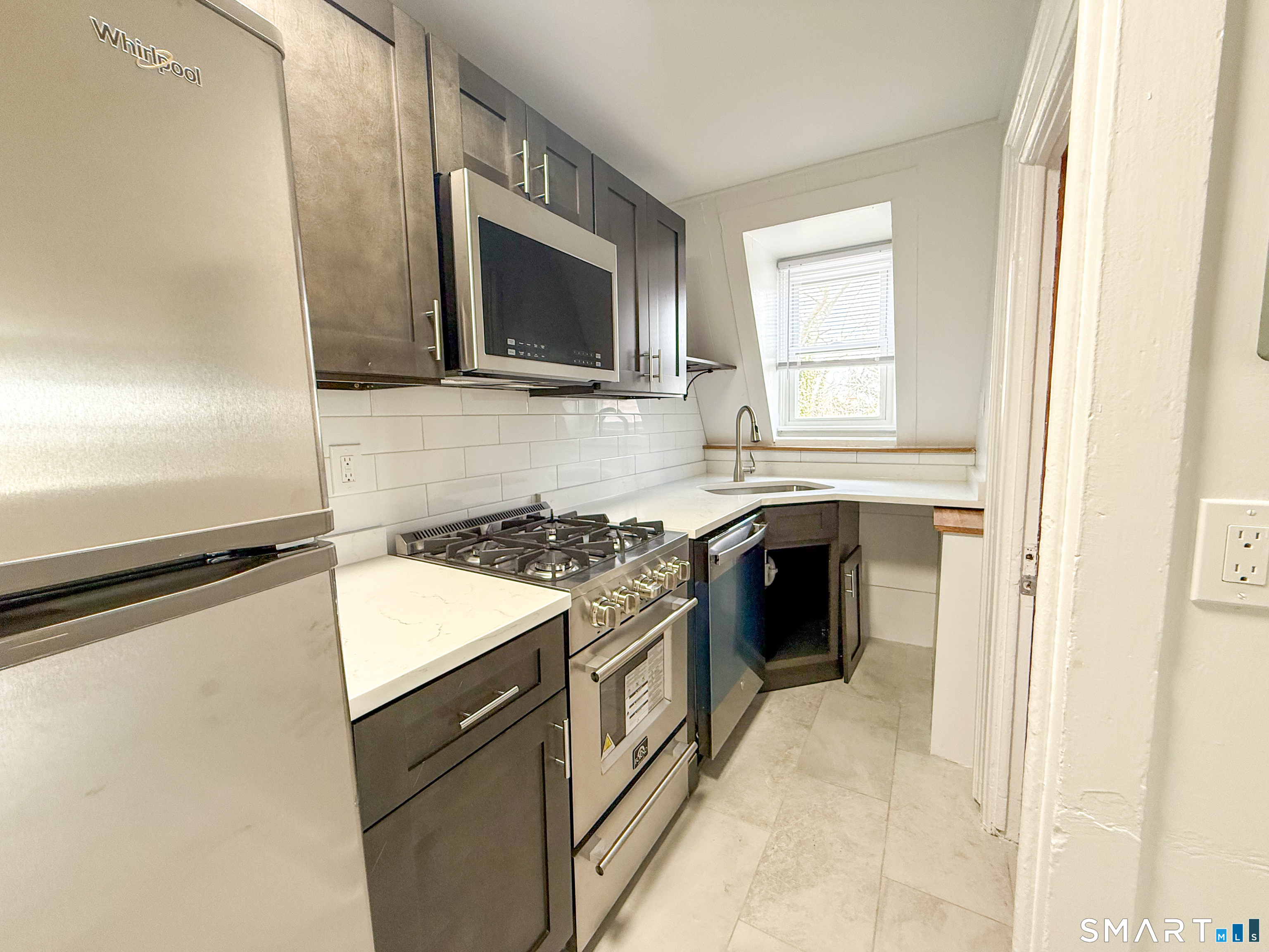 a kitchen with a stove and a microwave