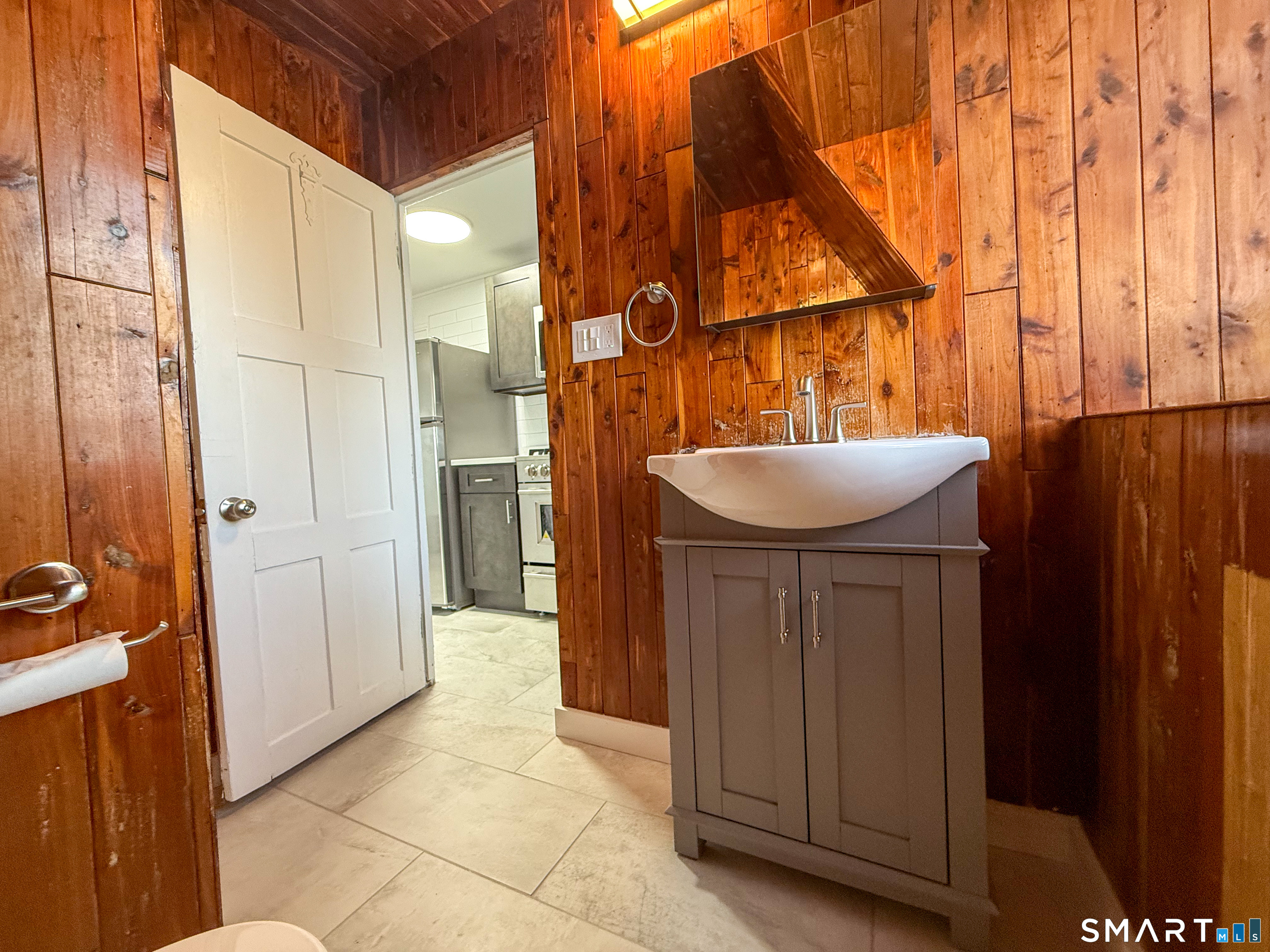 40 Franklin Street New London, CT 06320 - Photo 7 of 9 a bathroom with a sink and mirror