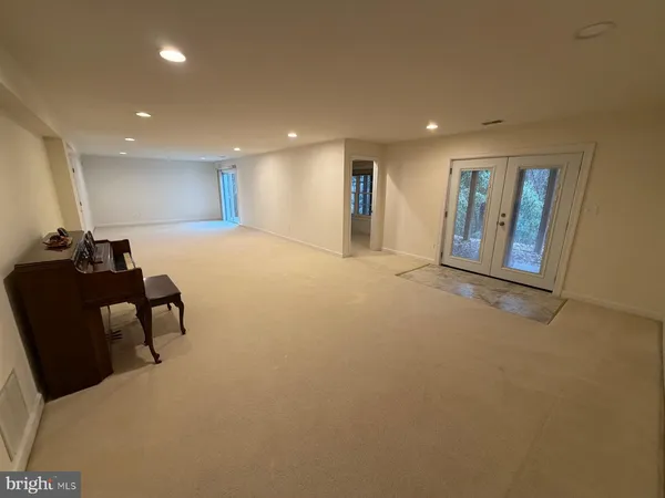 a view of a room with furniture and window