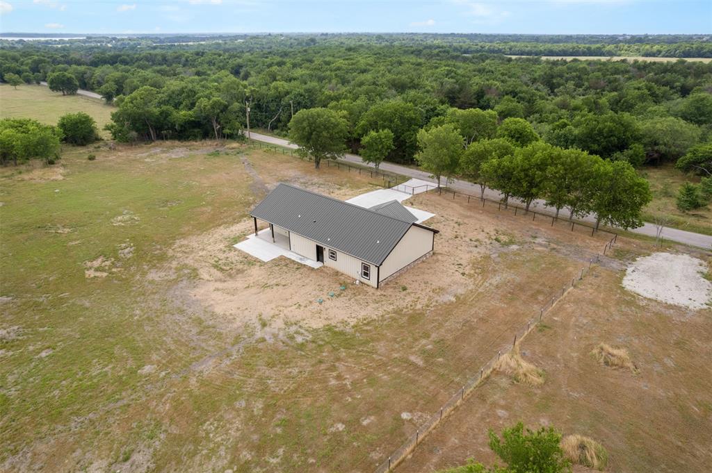 121 Brazier Road Ennis, TX 75119 - Photo 27 of 31 a view of a street with a yard
