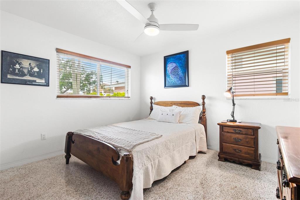 525 Lillian Drive Madeira Beach, FL 33708 - Photo 19 of 29 a bedroom with bed and a window