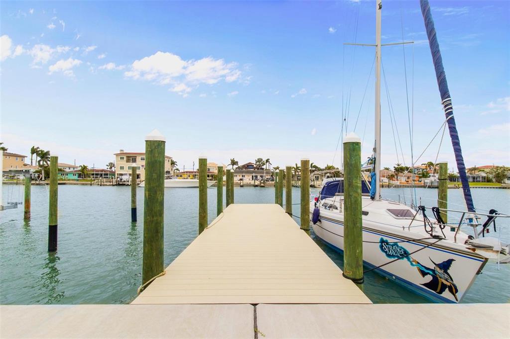 525 Lillian Drive Madeira Beach, FL 33708 - Photo 2 of 29 a view of a swimming pool with a lake view