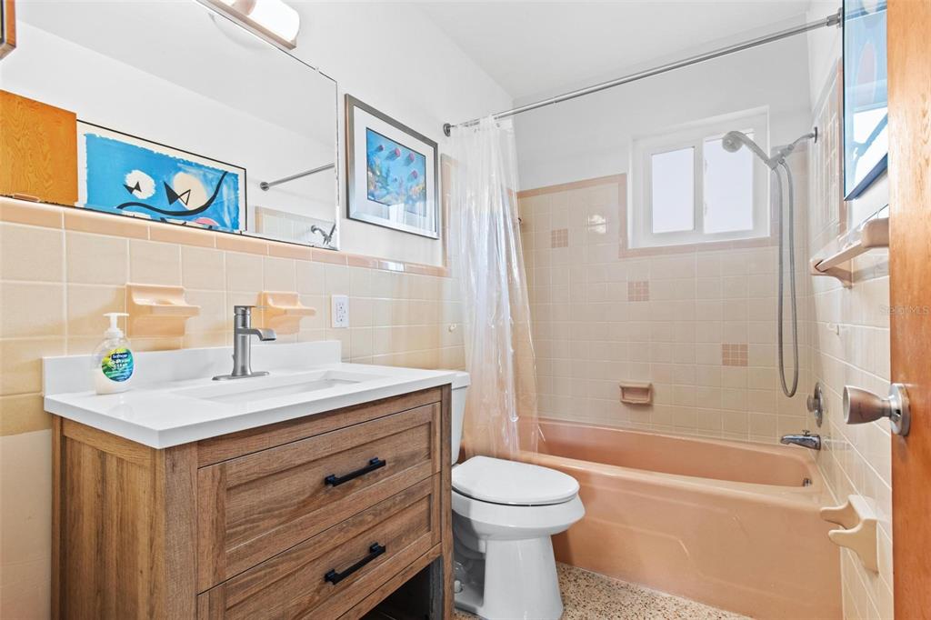 525 Lillian Drive Madeira Beach, FL 33708 - Photo 21 of 29 a bathroom with a sink a toilet and shower