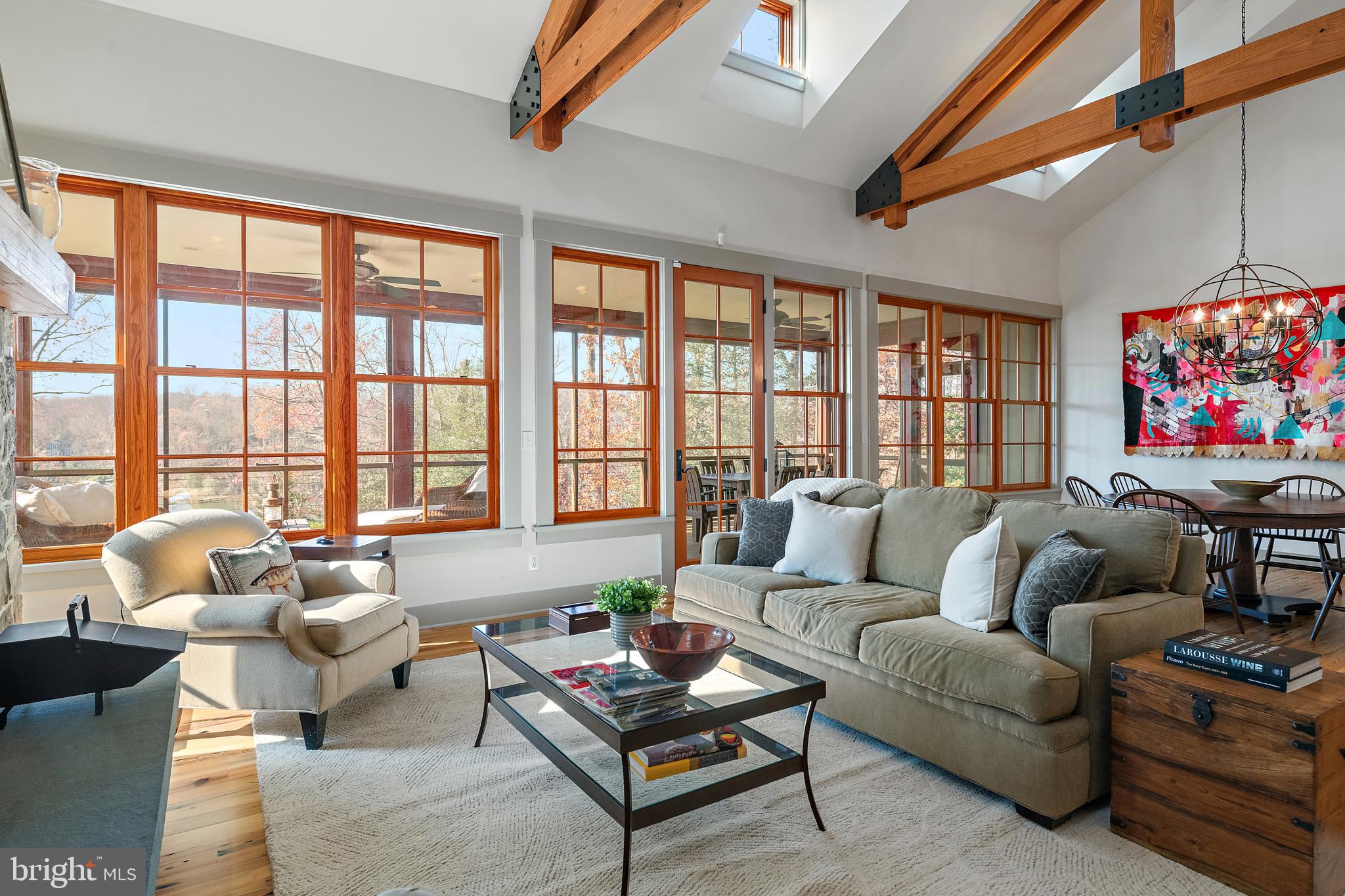 397 Forelands Road Annapolis, MD 21401 - Photo 17 of 83 a living room with furniture a rug and a floor to ceiling window