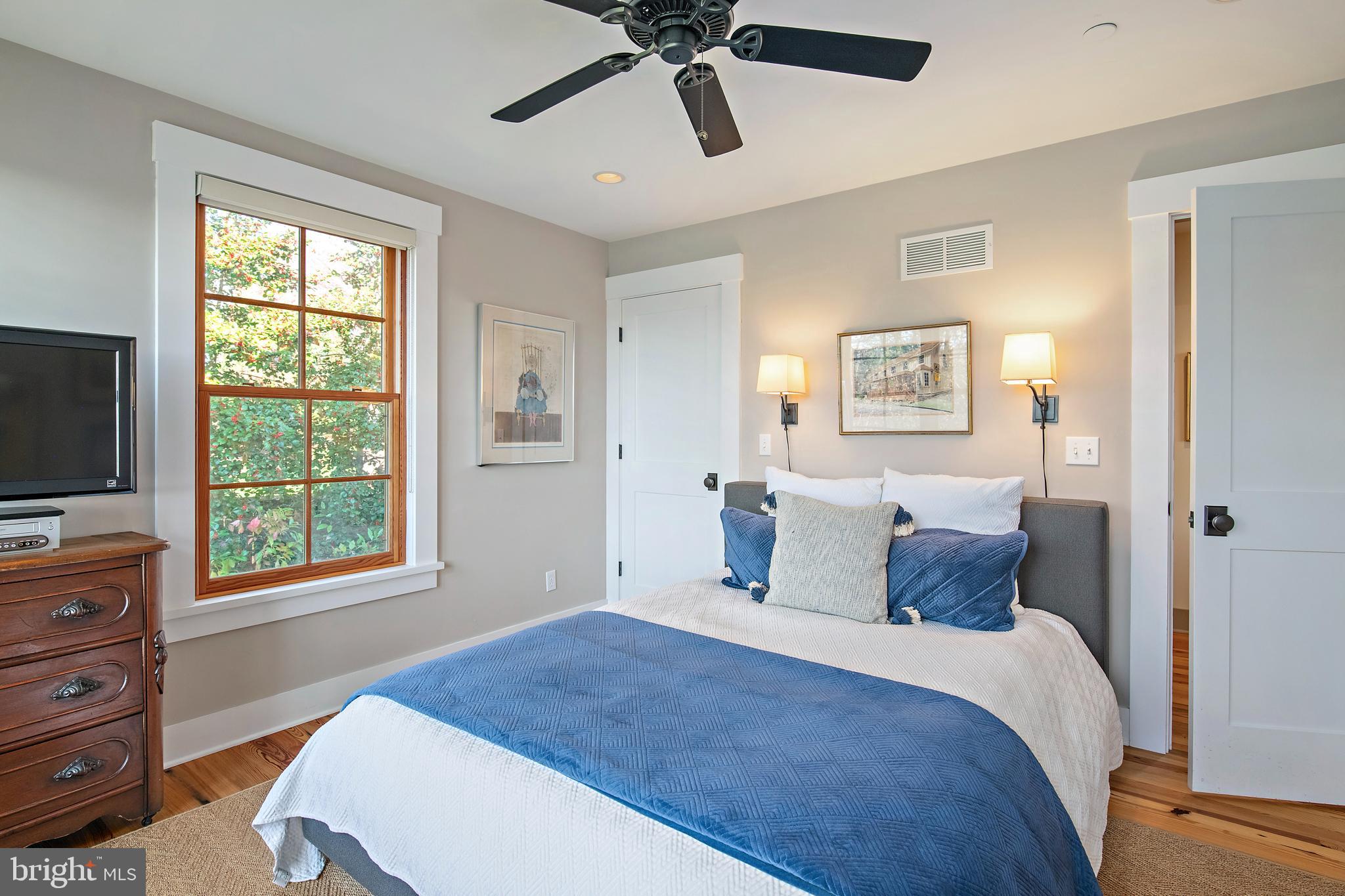 397 Forelands Road Annapolis, MD 21401 - Photo 56 of 83 a bedroom with a bed and a flat screen tv